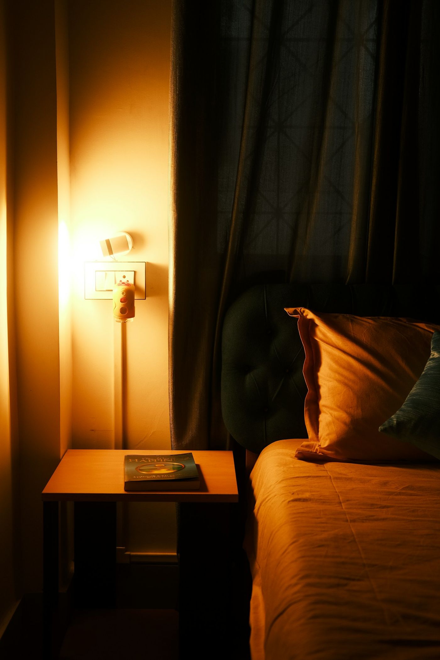 A warm bedside lamp at night